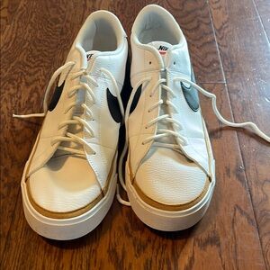 Nike White and Black Sneakers with Classic Low-Top Design